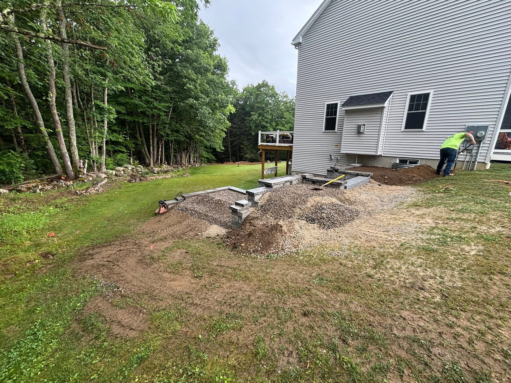 Hillside erosion problem before retaining wall installation